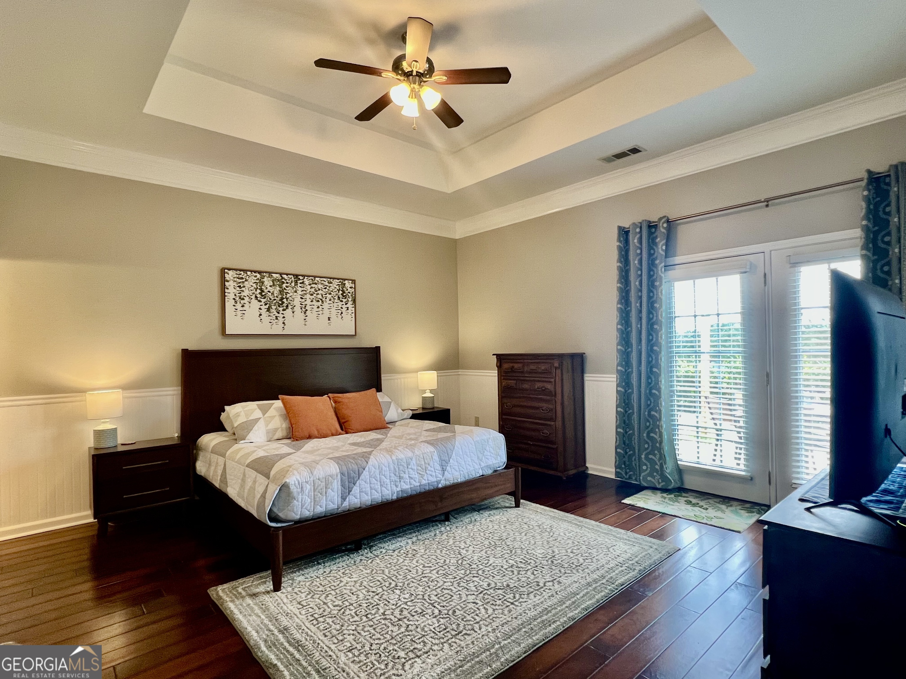 122 Millers Lane Calhoun, GA 30701 - Photo 22 of 60 a bedroom with a bed and wooden floor