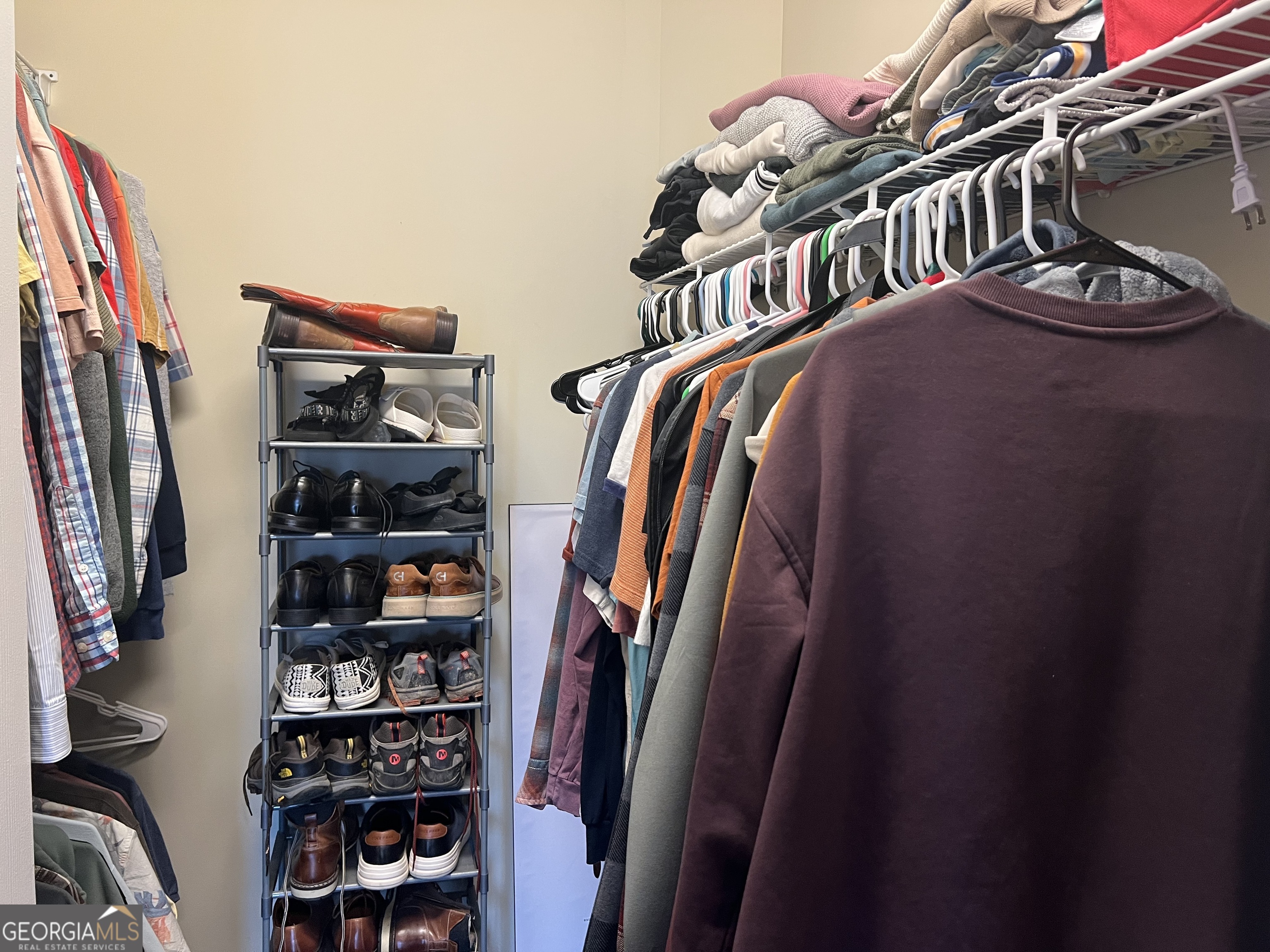 122 Millers Lane Calhoun, GA 30701 - Photo 31 of 60 a view of walk in closet with clothes and shoes