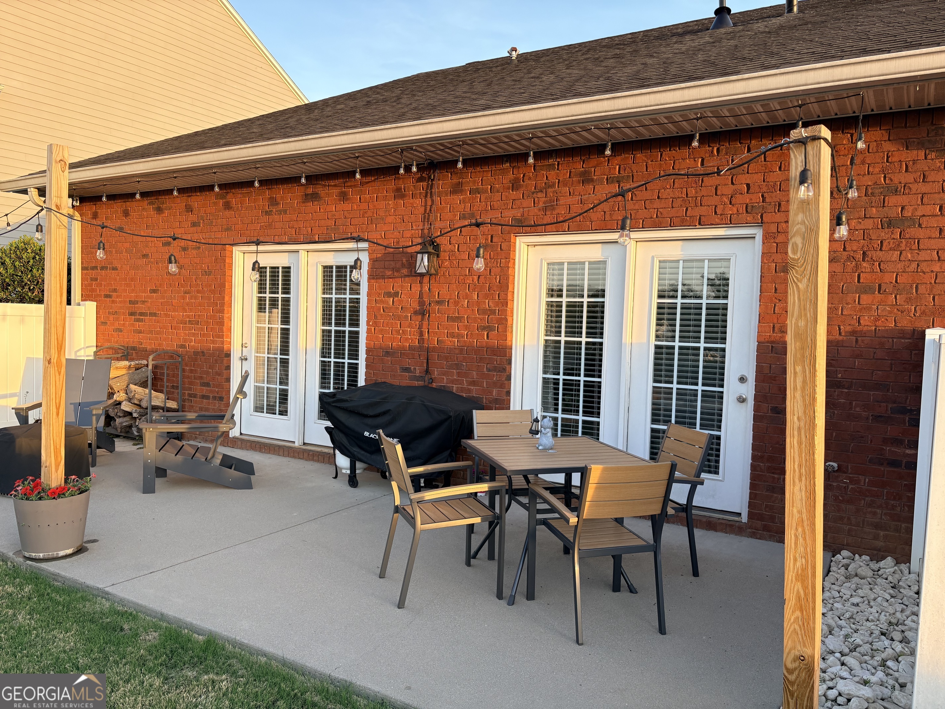 122 Millers Lane Calhoun, GA 30701 - Photo 39 of 60 a backyard of a house with outdoor seating