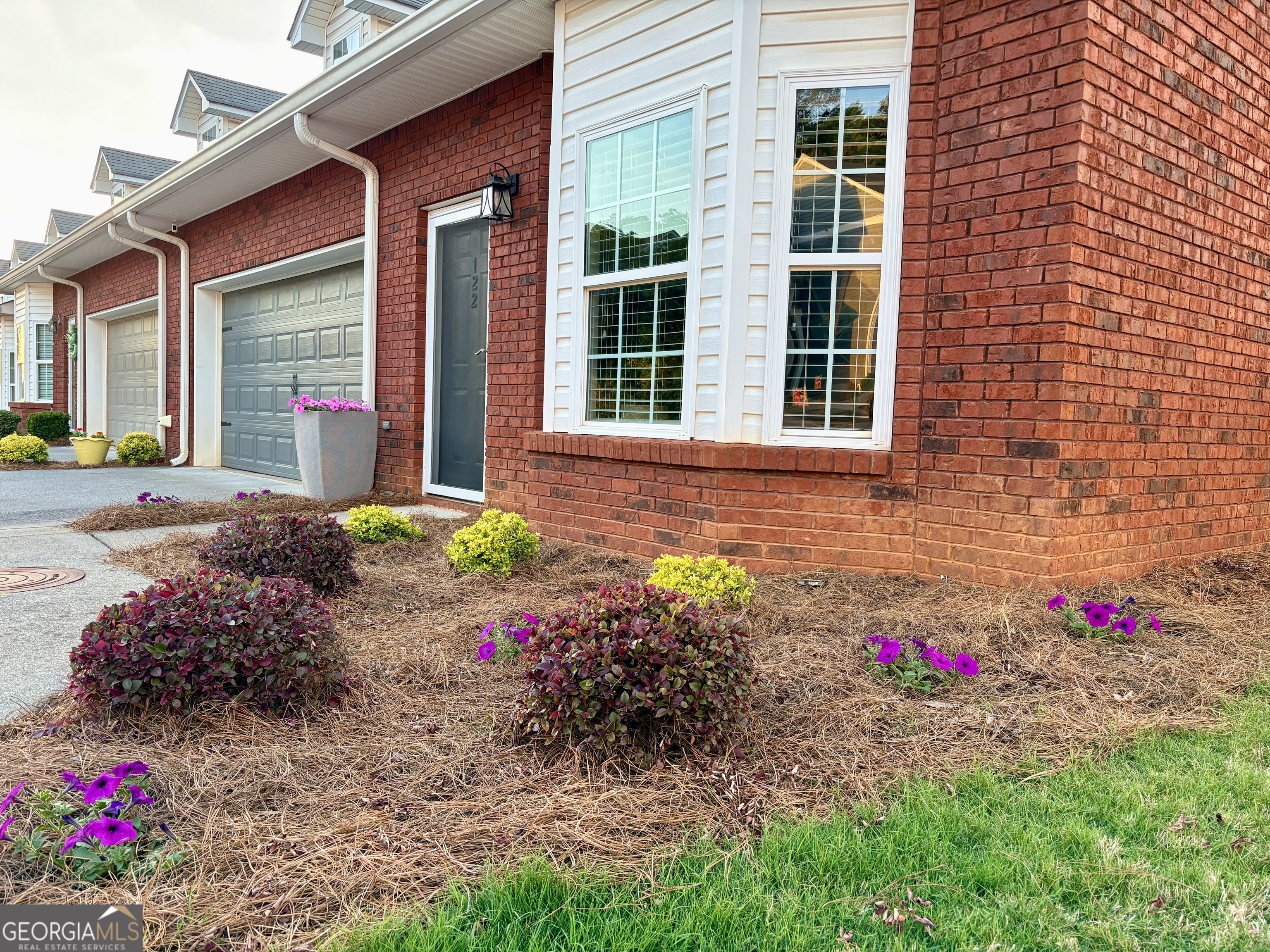 122 Millers Lane Calhoun, GA 30701 - Photo 59 of 60 a view of a house with a yard and garden