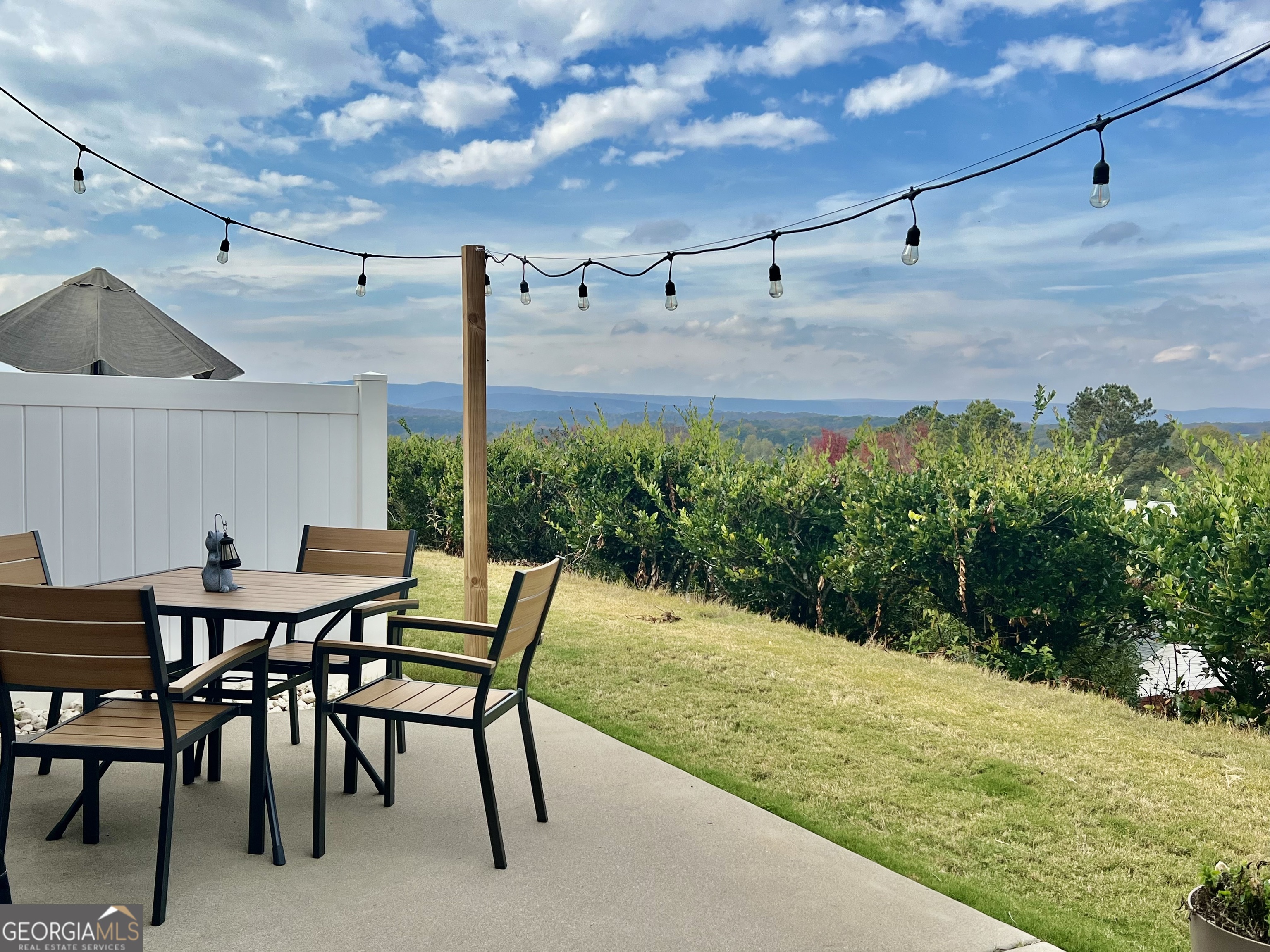 122 Millers Lane Calhoun, GA 30701 - Photo 60 of 60 a view of a patio with table and chairs and potted plants