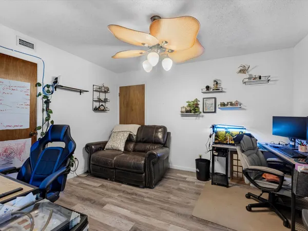 a view of a house with backyard porch and sitting area
