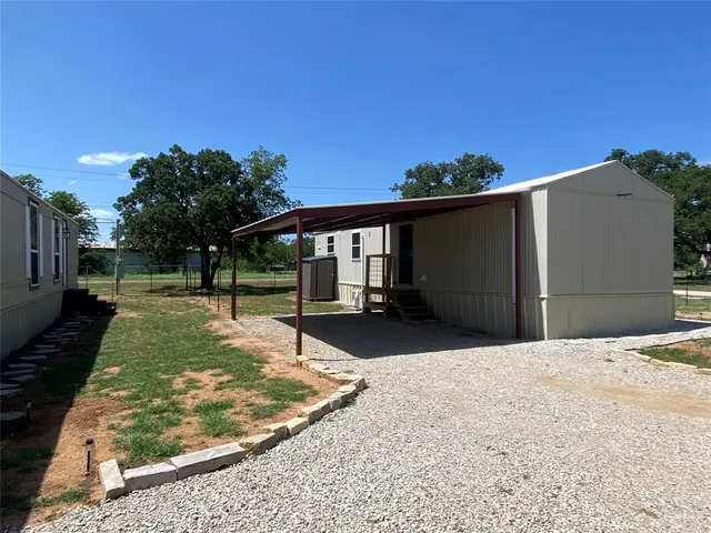 a view of a backyard of the house