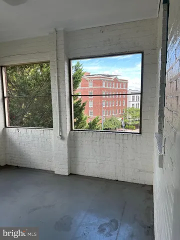 a view of a room with a large window
