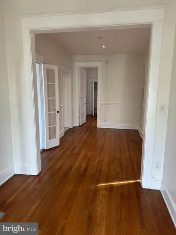 a view of a livingroom with wooden floor
