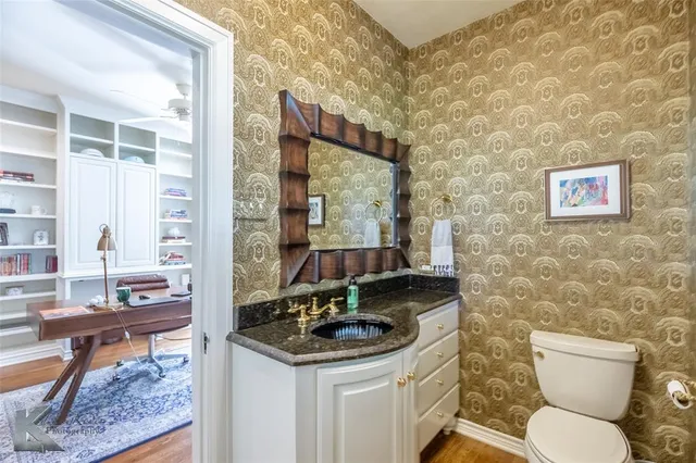 a bathroom with a toilet a sink and a shower