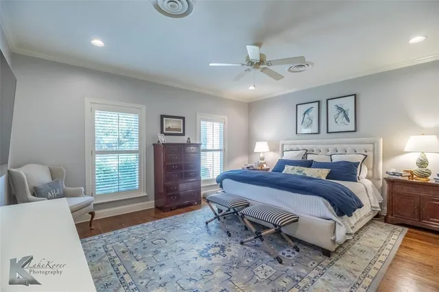 a spacious bedroom with a large bed and a window