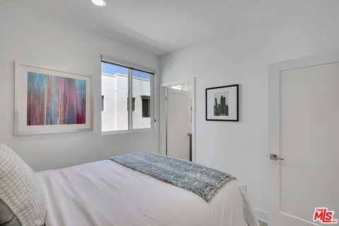 a view of a house with brick walls