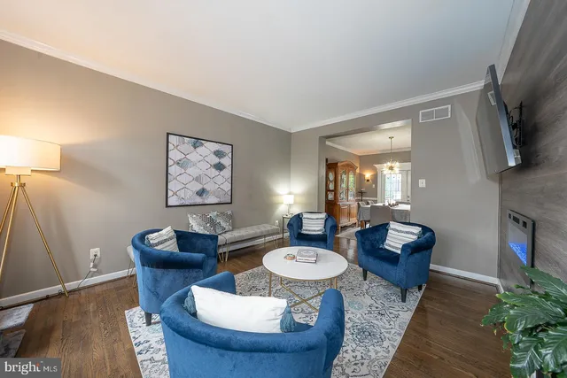 a kitchen with stainless steel appliances granite countertop a sink a stove and refrigerator