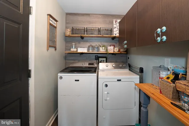 a bedroom with bed and a chandelier