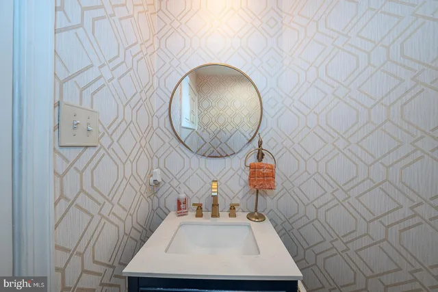 a bathroom with a double vanity sink toilet and a mirror