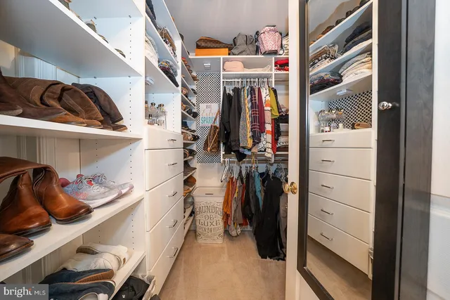 a view of an entryway with wooden floor and windows