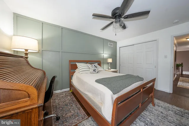 a view of a patio with couches table and chairs and potted plants