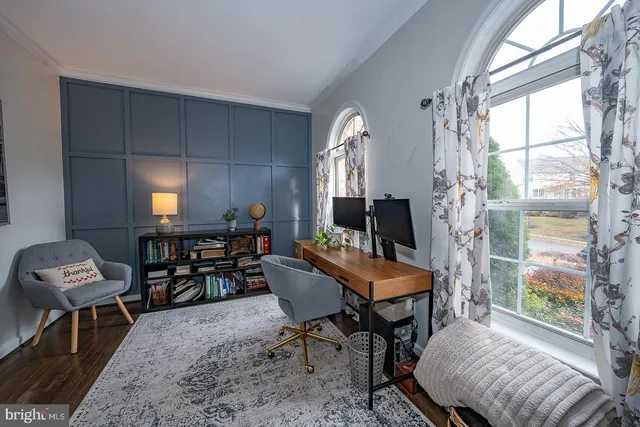 a living room with fireplace furniture and a flat screen tv