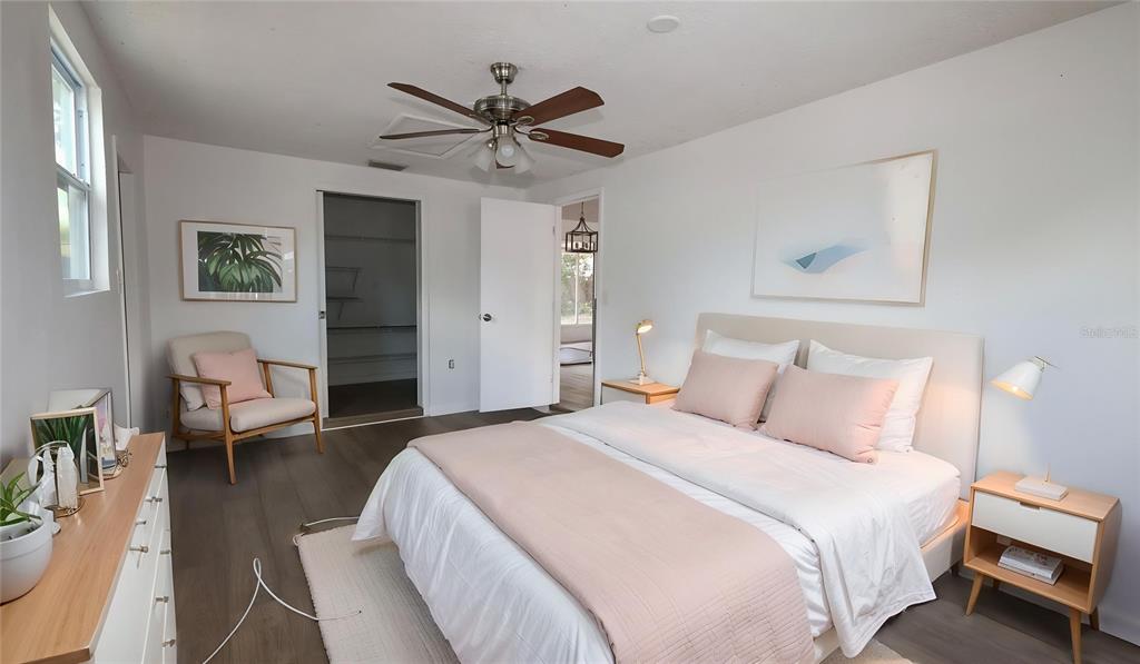 4300 Las Vegas Drive New Port Richey, FL 34653 - Photo 6 of 14 a bedroom with a bed and a chandelier