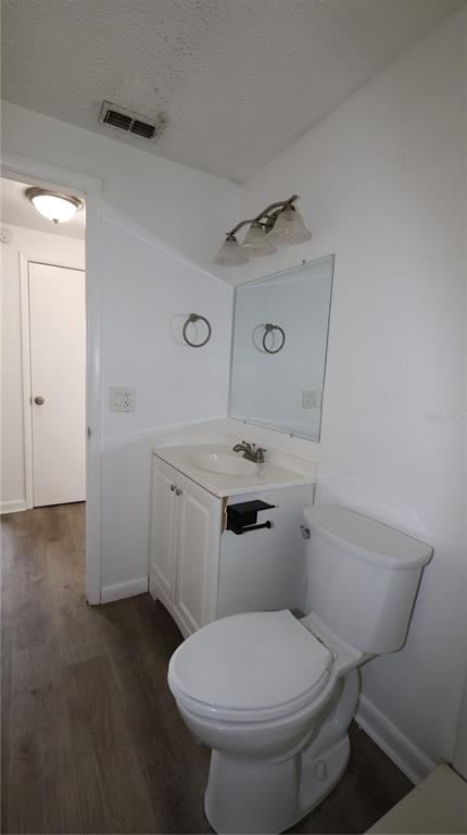 4300 Las Vegas Drive New Port Richey, FL 34653 - Photo 8 of 14 a white toilet sitting next to a bathroom sink