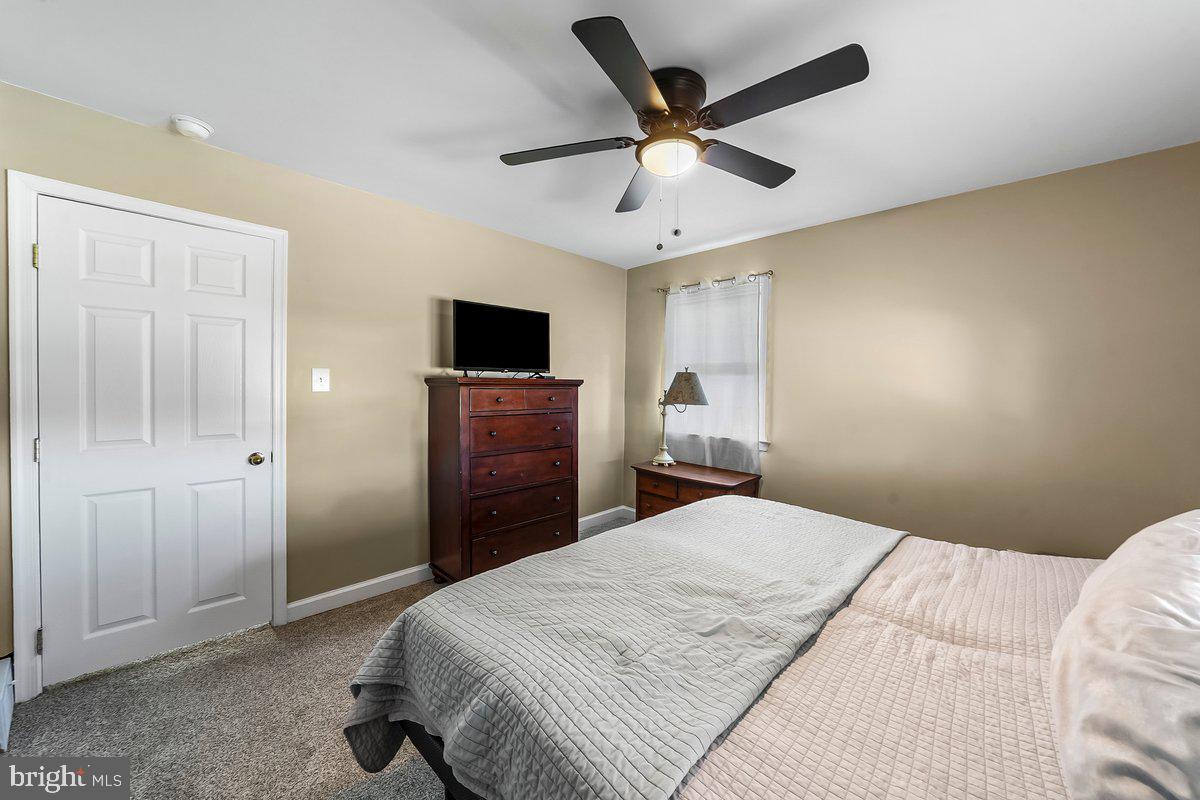 114 Lakeview Drive Ridley Park, PA 19078 - Photo 14 of 37 a bedroom with a bed and a tv