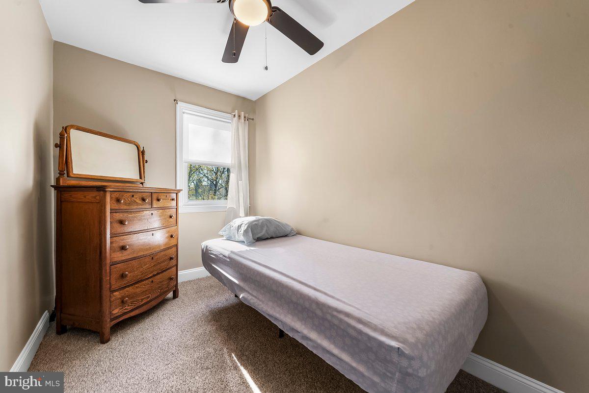 114 Lakeview Drive Ridley Park, PA 19078 - Photo 16 of 37 a bedroom with a bed and a tv