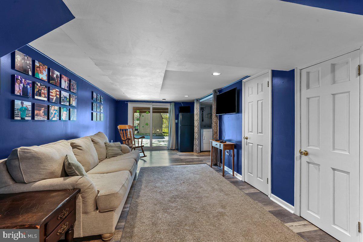 114 Lakeview Drive Ridley Park, PA 19078 - Photo 20 of 37 a living room with furniture and a flat screen tv