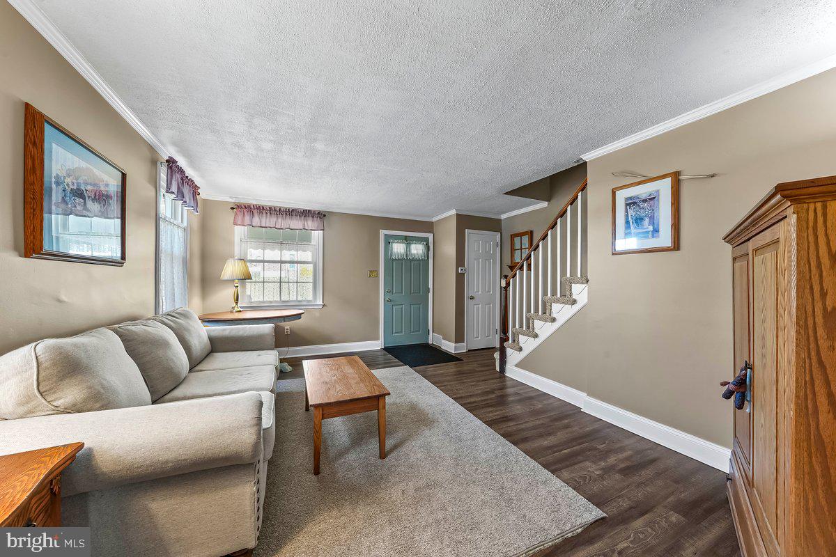 114 Lakeview Drive Ridley Park, PA 19078 - Photo 2 of 37 a living room with furniture and a window