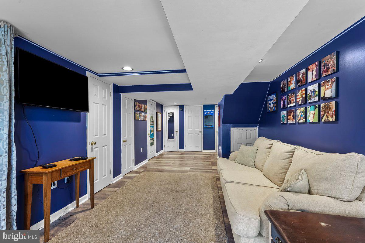 114 Lakeview Drive Ridley Park, PA 19078 - Photo 21 of 37 a living room with furniture fireplace and a flat screen tv