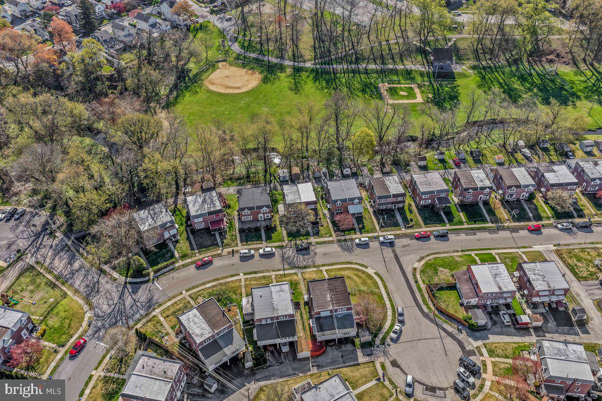 114 Lakeview Drive Ridley Park, PA 19078 - Photo 30 of 37 an aerial view of a swimming pool with outdoor seating and city view