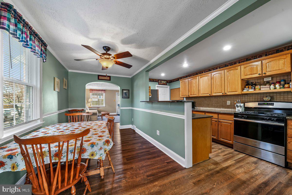 114 Lakeview Drive Ridley Park, PA 19078 - Photo 7 of 37 a kitchen with stainless steel appliances granite countertop a stove a sink dishwasher and a refrigerator with wooden floor