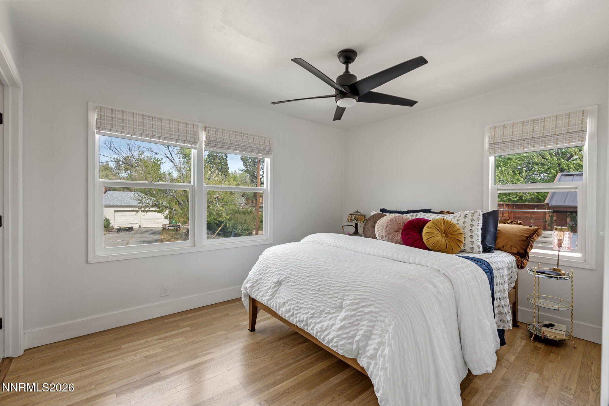 1530 Elmcrest Drive Reno, NV 89503 - Photo 17 of 36 a bedroom with a bed and wooden floor