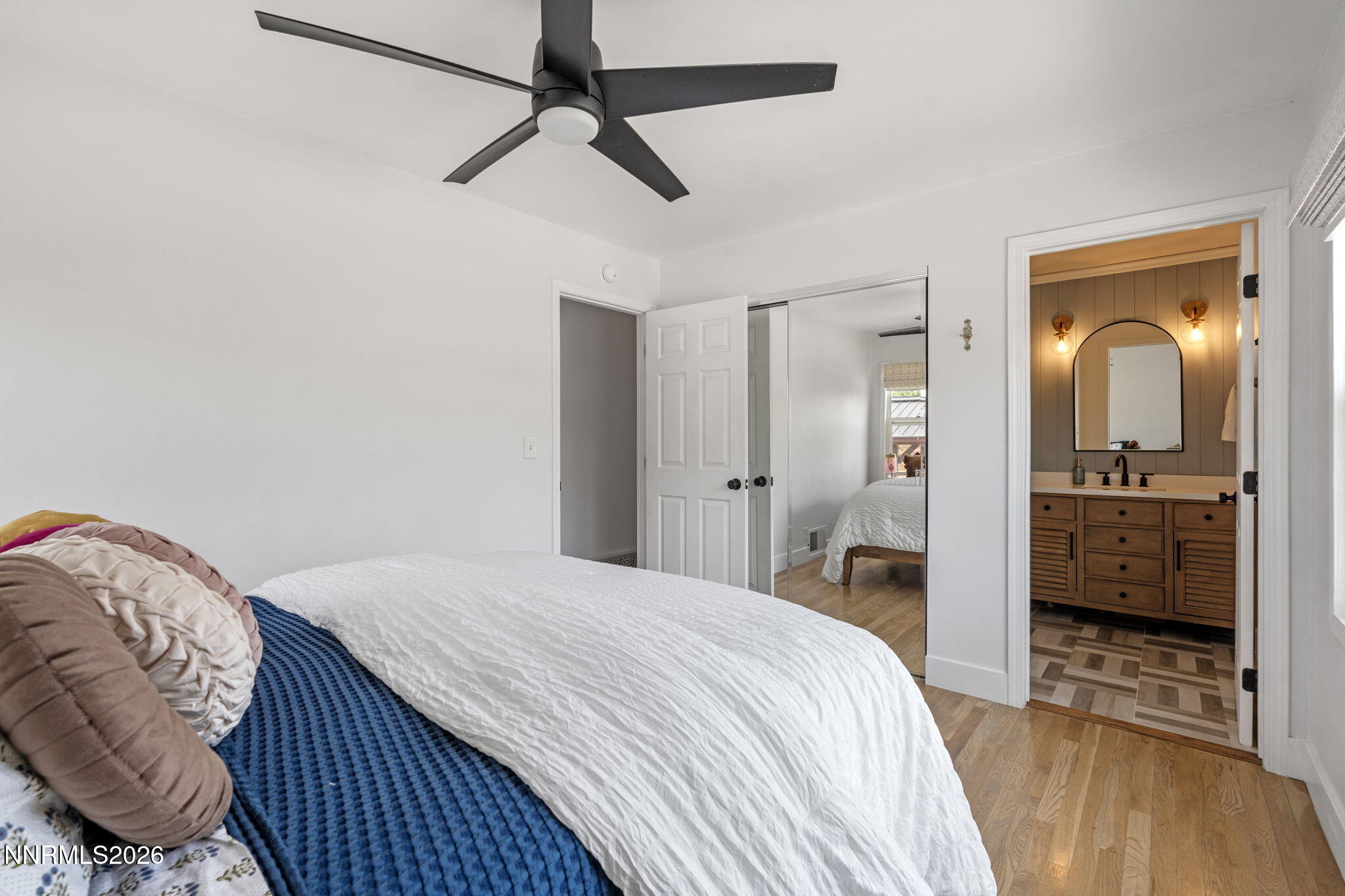 1530 Elmcrest Drive Reno, NV 89503 - Photo 18 of 36 a bedroom with a bed and a view of bathroom