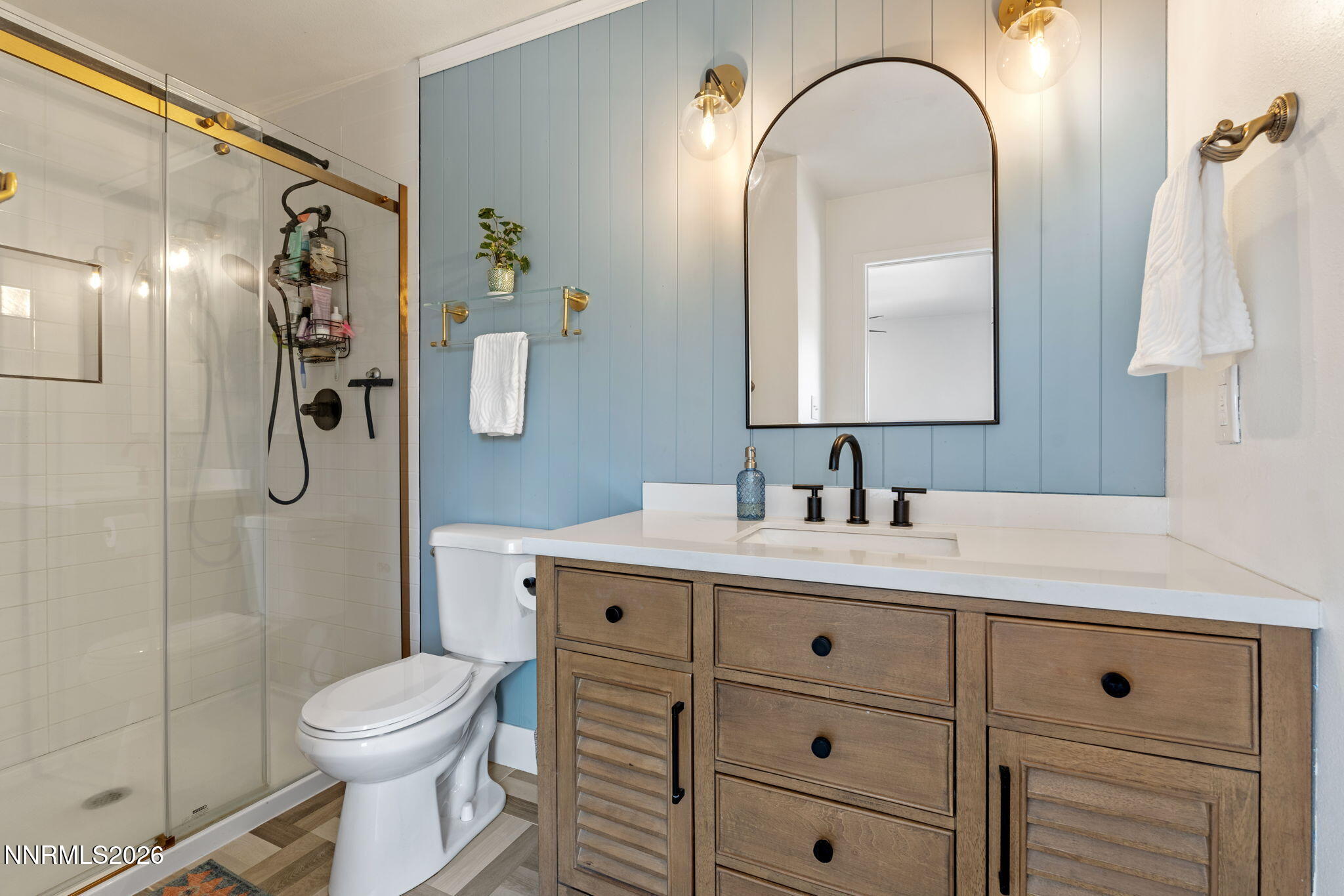1530 Elmcrest Drive Reno, NV 89503 - Photo 19 of 36 a bathroom with a sink a toilet and shower