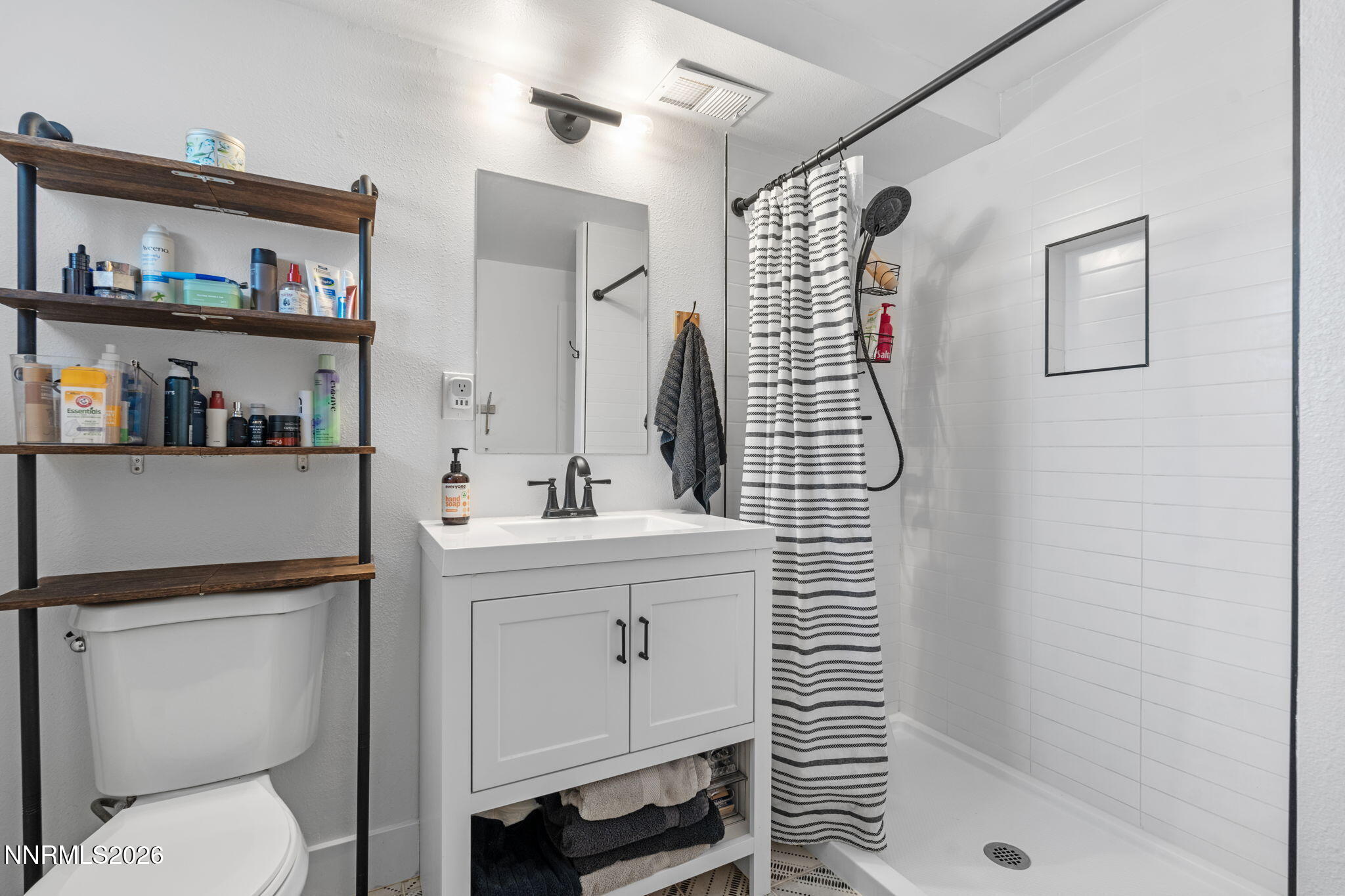 1530 Elmcrest Drive Reno, NV 89503 - Photo 25 of 36 a bathroom with a sink a toilet and shower