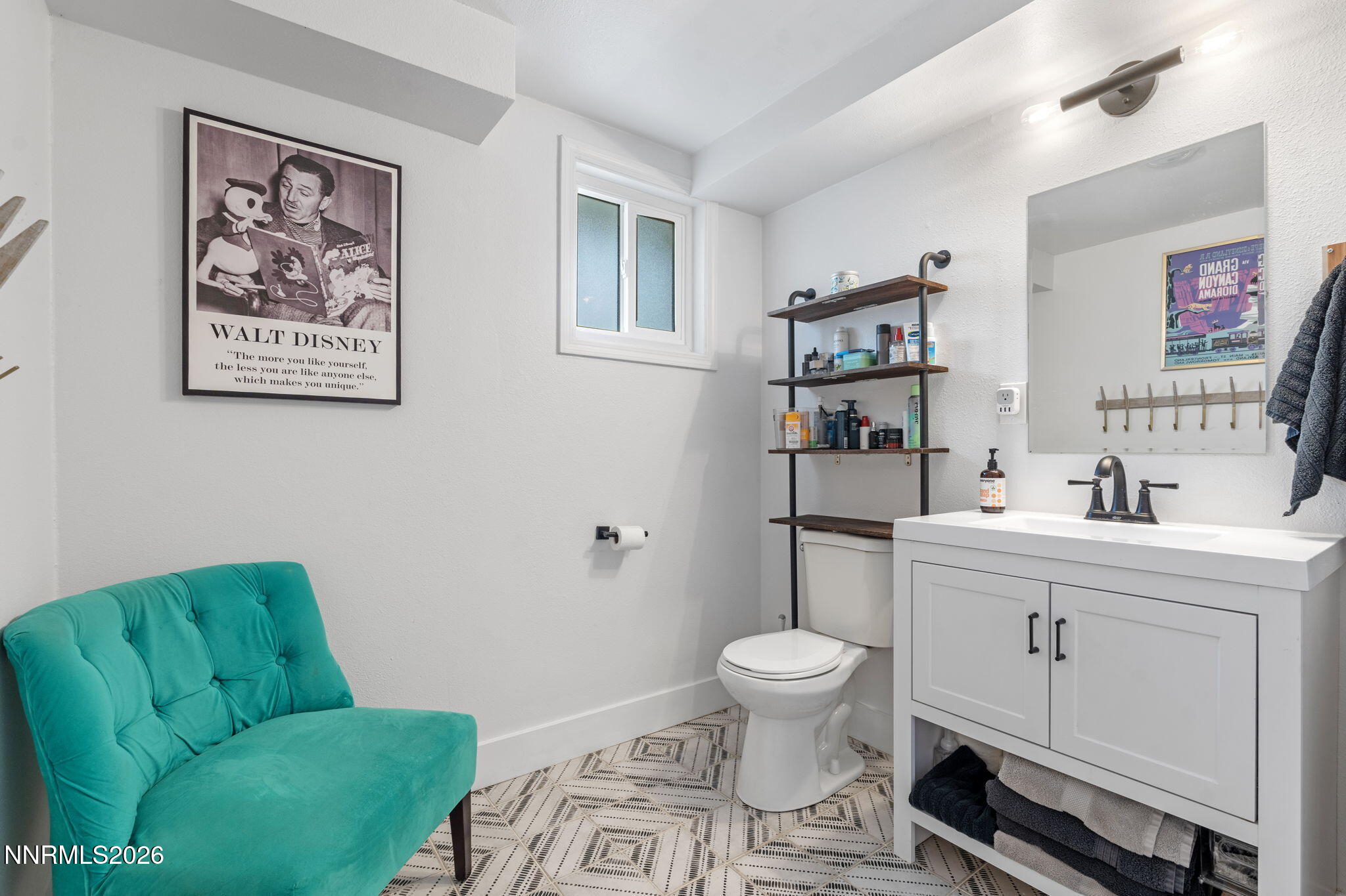 1530 Elmcrest Drive Reno, NV 89503 - Photo 26 of 36 a bathroom with a toilet sink and mirror
