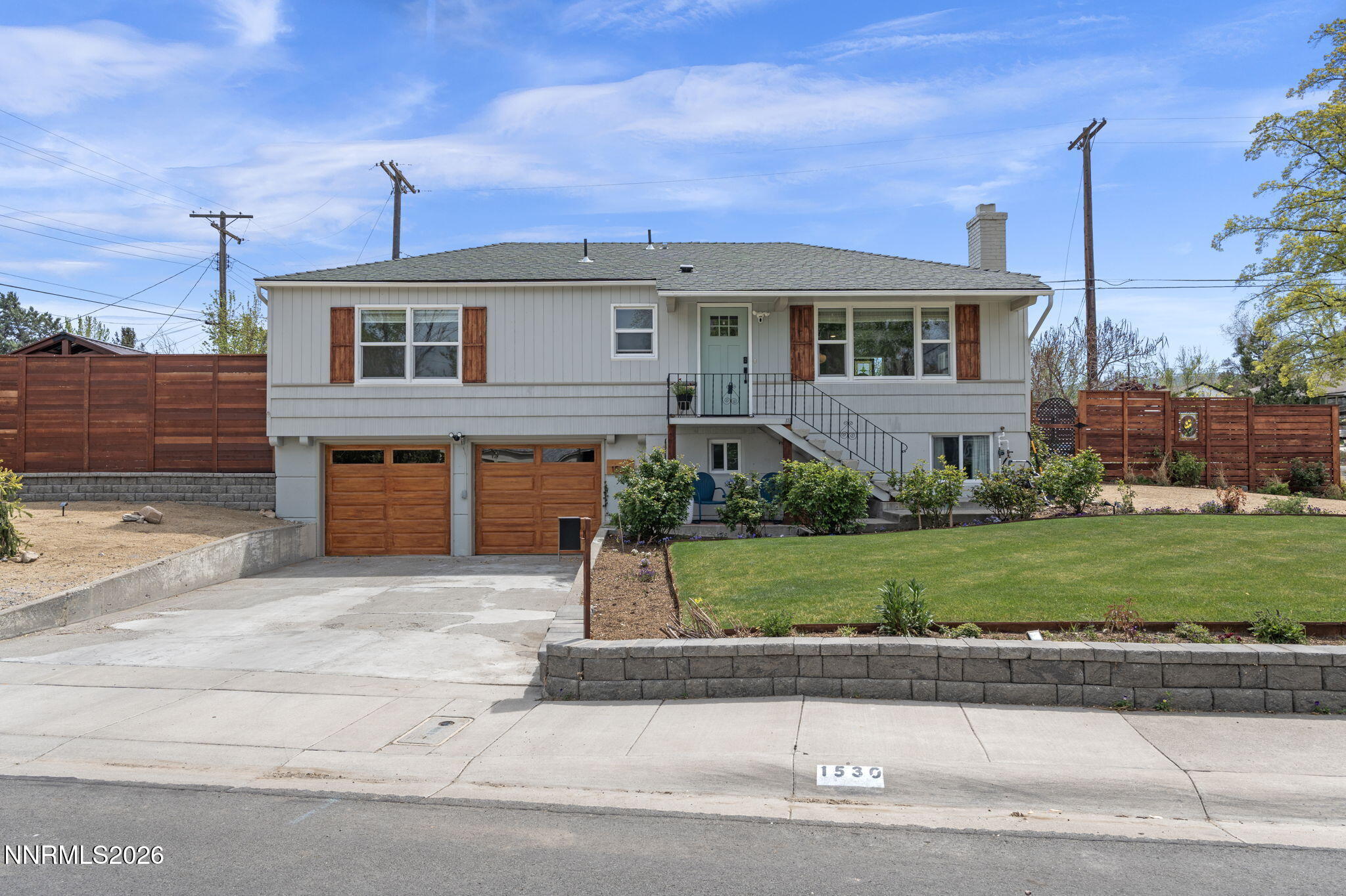 1530 Elmcrest Drive Reno, NV 89503 - Photo 3 of 36 a front view of a house with a yard
