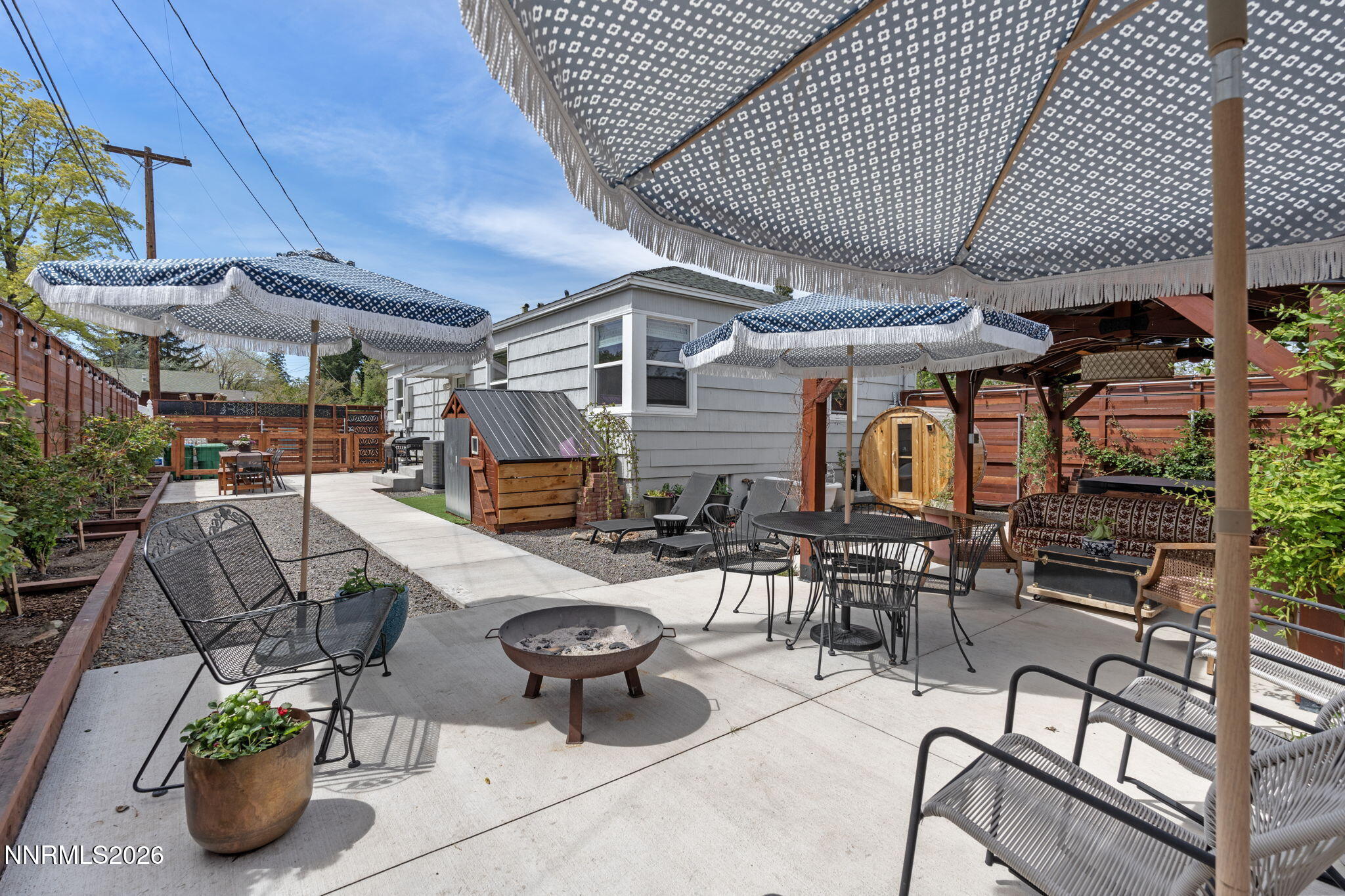 1530 Elmcrest Drive Reno, NV 89503 - Photo 32 of 36 a view of a patio with table and chairs potted plants
