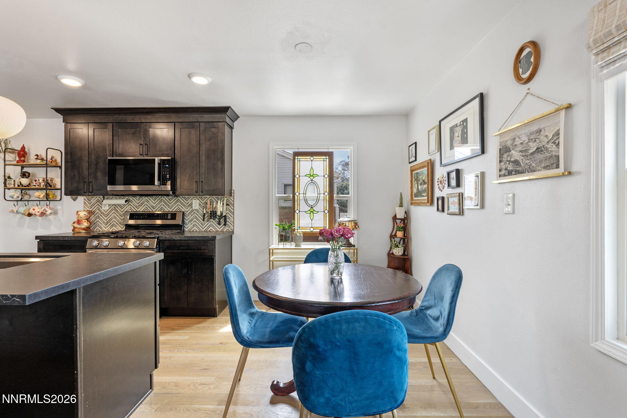 1530 Elmcrest Drive Reno, NV 89503 - Photo 9 of 36 a kitchen with a dining table and chairs