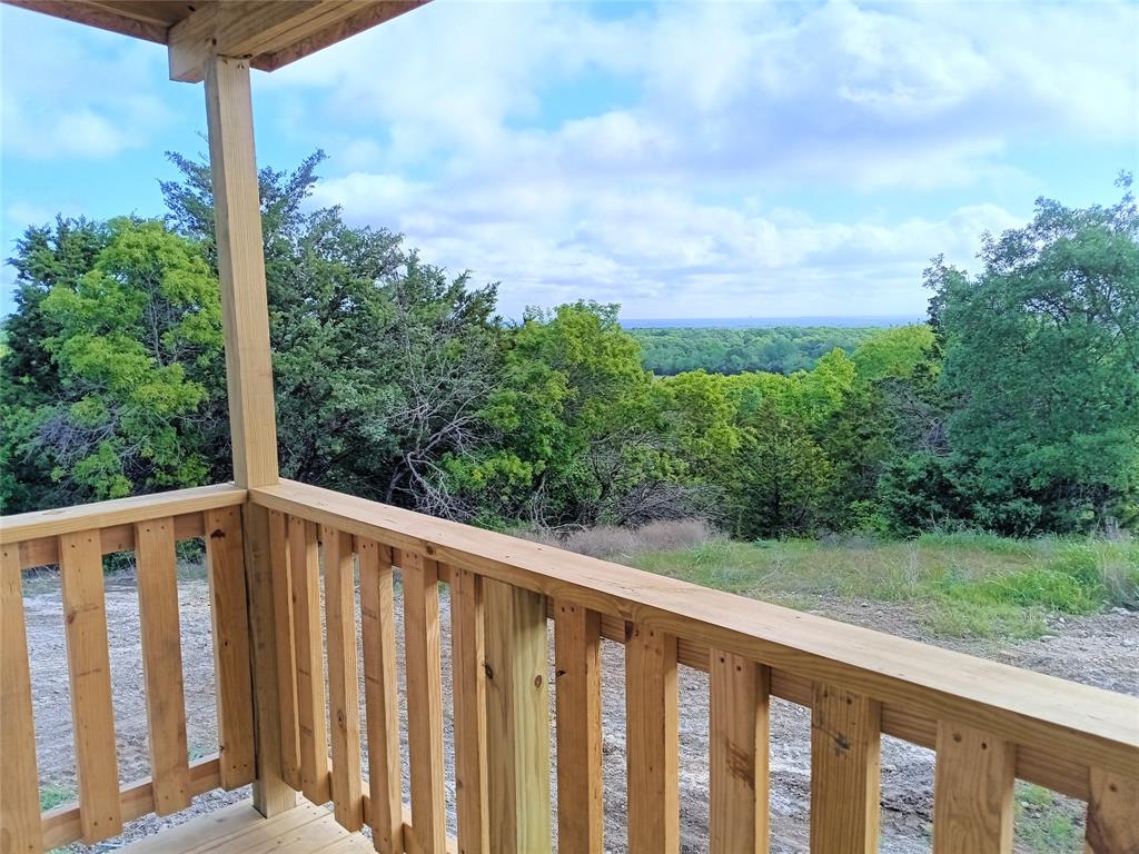 700 Woodhaven Drive Springtown, TX 76082 - Photo 2 of 15 a view of a wooden fence