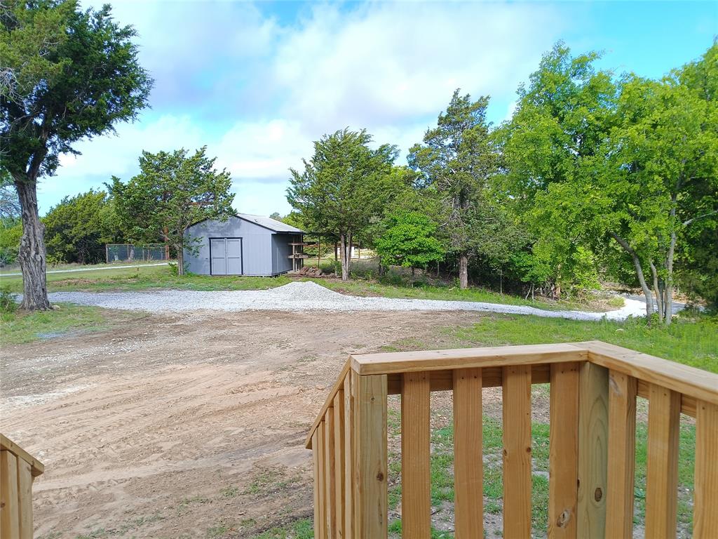 700 Woodhaven Drive Springtown, TX 76082 - Photo 6 of 15 a view of a house with a yard