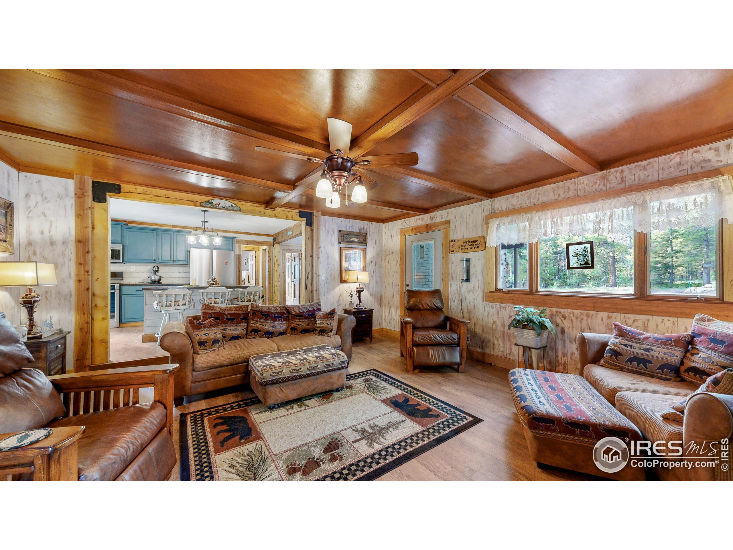 2420 Big Owl Road Allenspark, CO 80510 - Photo 16 of 40 a living room with furniture and a large window