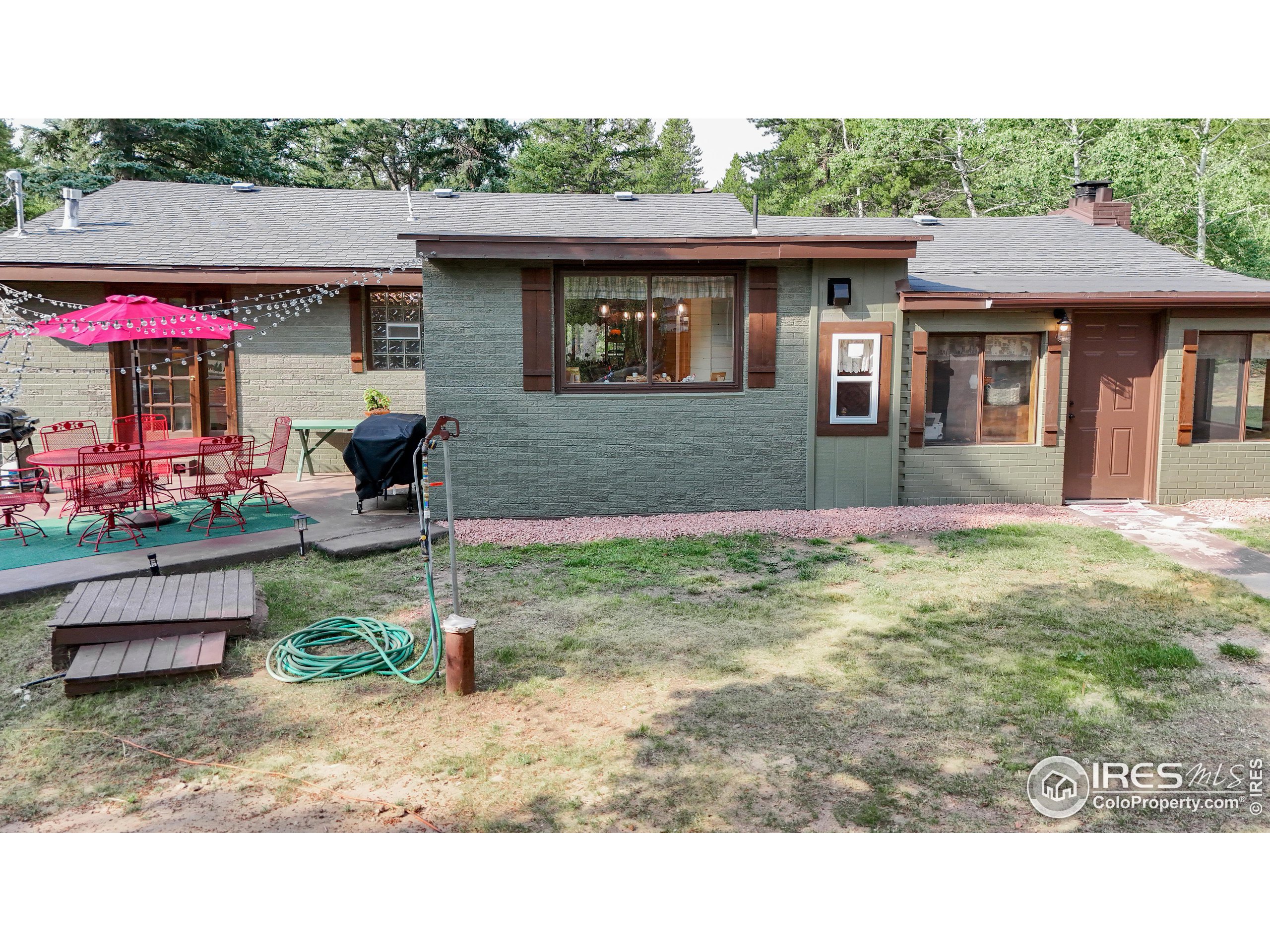 2420 Big Owl Road Allenspark, CO 80510 - Photo 34 of 40 a house view with a garden space