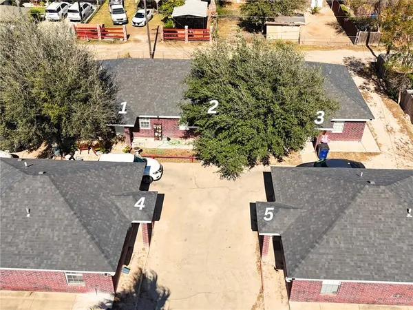 an aerial view of residential houses with outdoor space