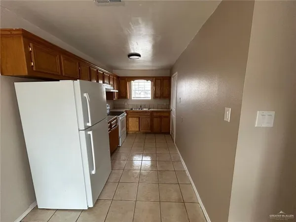 a kitchen with refrigerator a sink and dishwasher