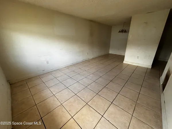 a view of an empty room and storage
