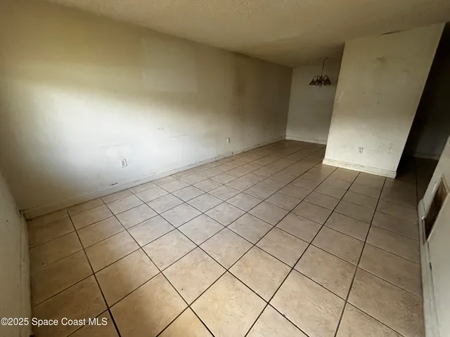 a view of an empty room and storage