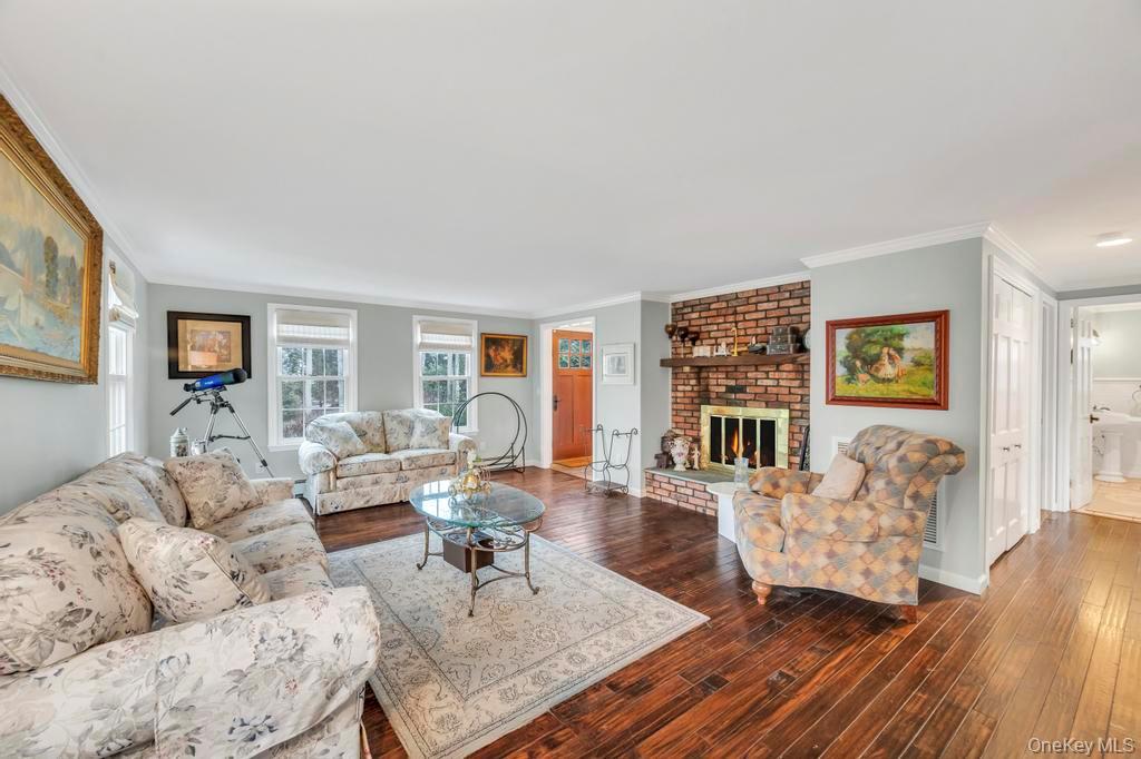 807 Union Avenue Riverhead, NY 11901 - Photo 15 of 43 a living room with furniture and wooden floor