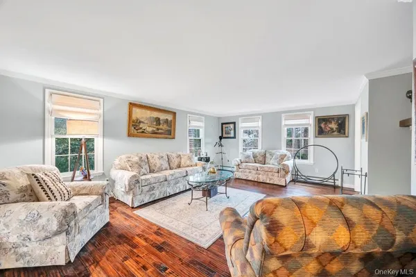 a living room with furniture rug and window