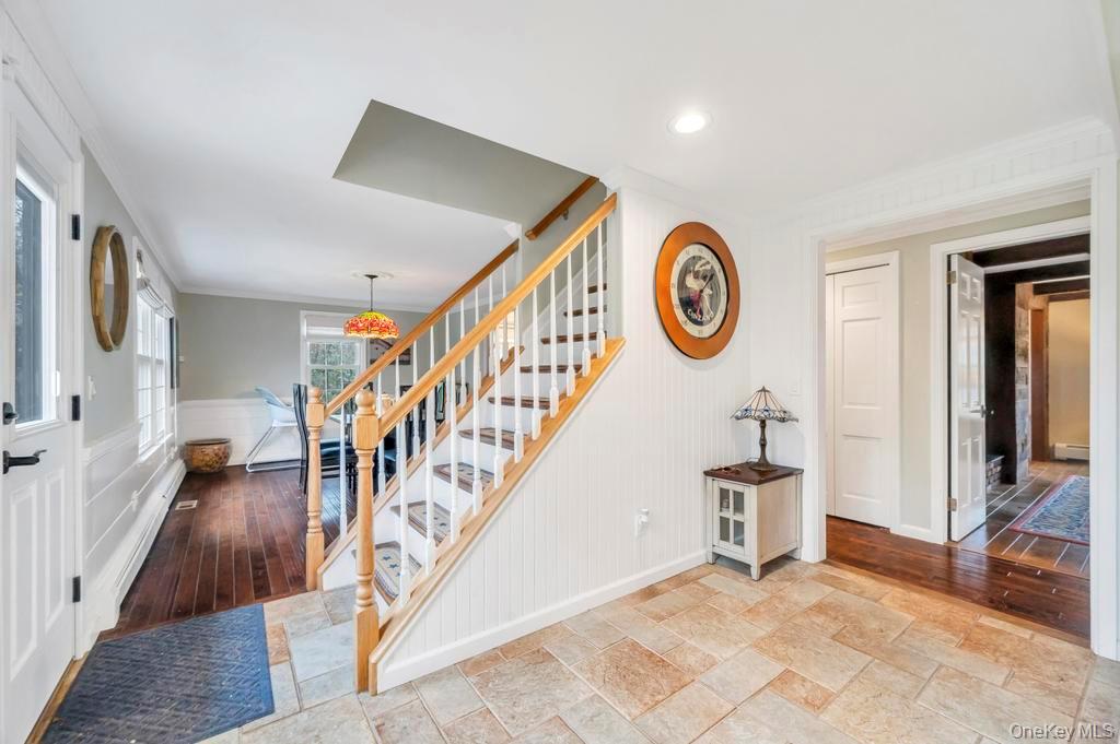 807 Union Avenue Riverhead, NY 11901 - Photo 19 of 41 a view of an entryway with wooden floor and door