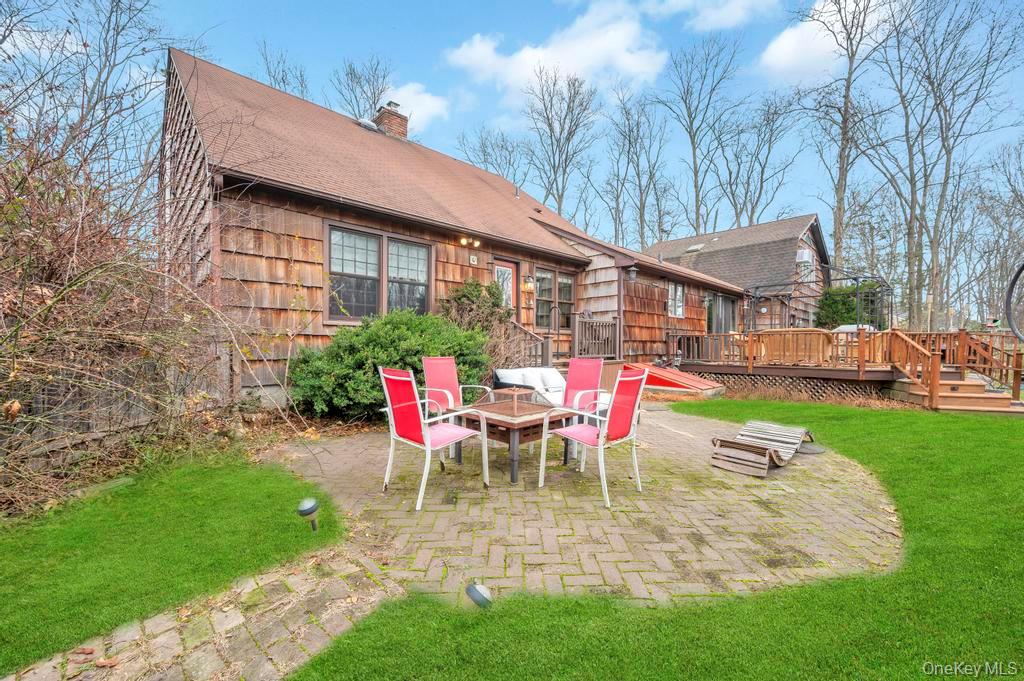 807 Union Avenue Riverhead, NY 11901 - Photo 36 of 41 a view of a house with backyard and sitting area