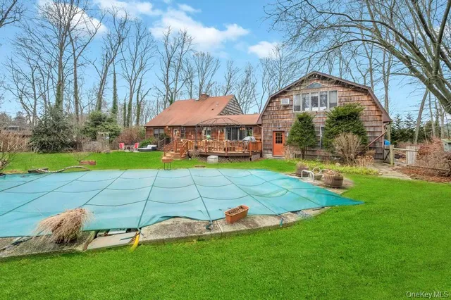a view of yard with swimming pool and green space