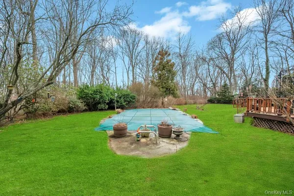 a view of a backyard with sitting area