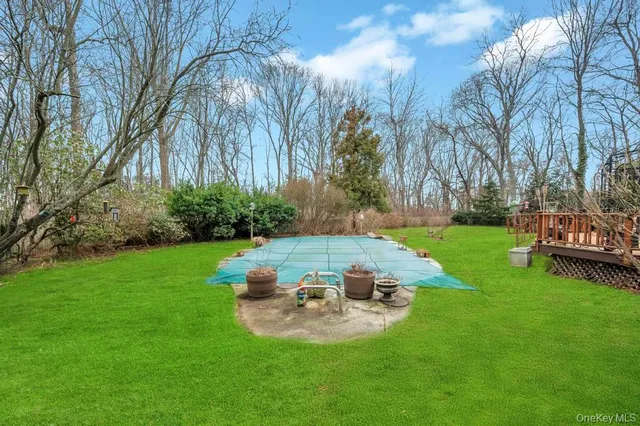 a view of a backyard with sitting area